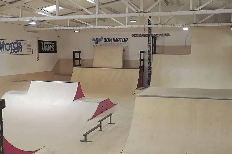 Photograph of indoor skatepark at Streetlight and Streetlight Logo